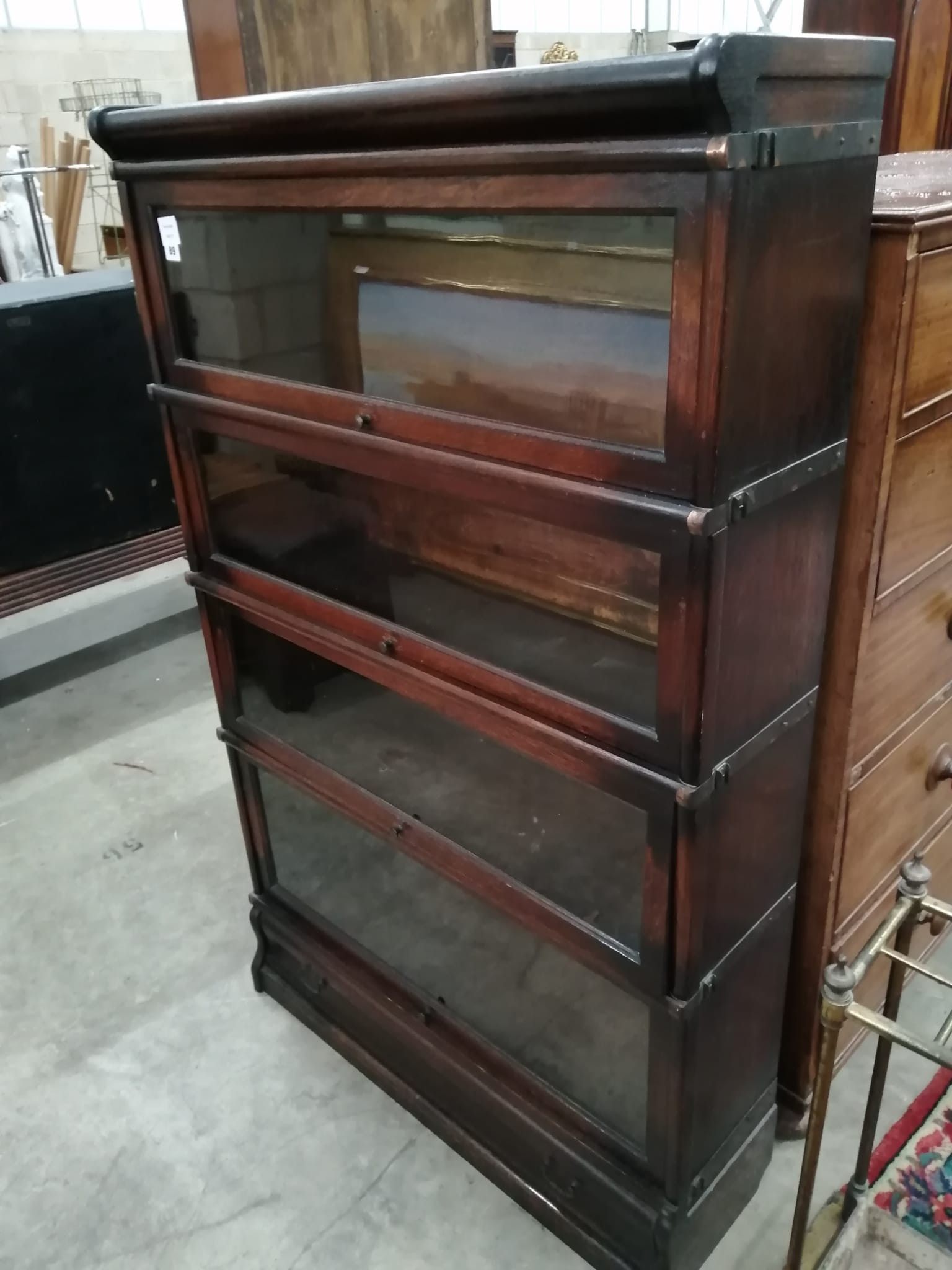 A Globe Wernicke glazed oak four section bookcase, width 86cm, depth 27cm, height 140cm